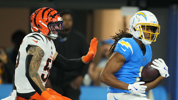 Nov 17, 2024; Inglewood, California, USA; Los Angeles Chargers wide receiver Quentin Johnston (1) is defended by Cincinnati Bengals linebacker Logan Wilson (55) on a 26-yard touchdown reception in the first half at SoFi Stadium. Mandatory Credit: Kirby Lee-Imagn Images