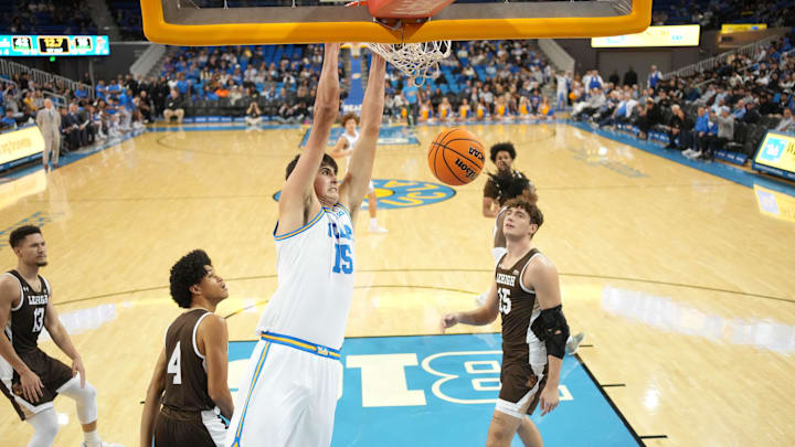 Nov 15, 2024; Los Angeles, California, USA; UCLA Bruins center Aday Mara (15) dunks the ball against the Lehigh Mountain Hawks in the first half at Pauley Pavilion presented by Wescom. Mandatory Credit: Kirby Lee-Imagn Images