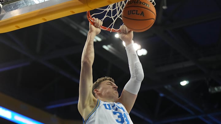 Nov 15, 2024; Los Angeles, California, USA; UCLA Bruins forward Tyler Bilodeau (34) dunks the ball against the Lehigh Mountain Hawks in the second half at Pauley Pavilion presented by Wescom. Mandatory Credit: Kirby Lee-Imagn Images