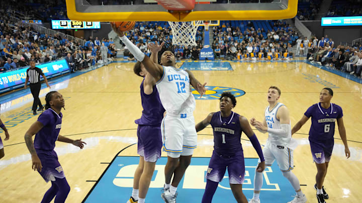 Dec 3, 2024; Los Angeles, California, USA; UCLA Bruins guard Sebastian Mack (12) shoots the ball against the Washington Huskies in the first half at Pauley Pavilion presented by Wescom. Mandatory Credit: Kirby Lee-Imagn Images