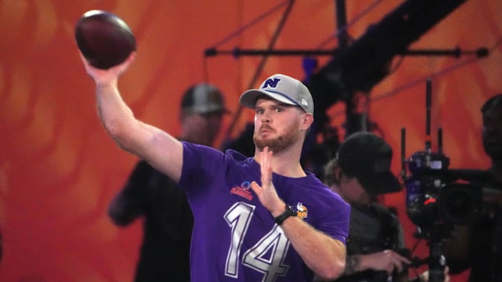 Jan 30, 2025; Orlando, FL, USA; NFC quarterback Sam Darnold (14) throws the ball in the Passing the Test event during the Pro Bowl Skills Challenge at Nicholson Fieldhouse. Mandatory Credit: Kirby Lee-Imagn Images