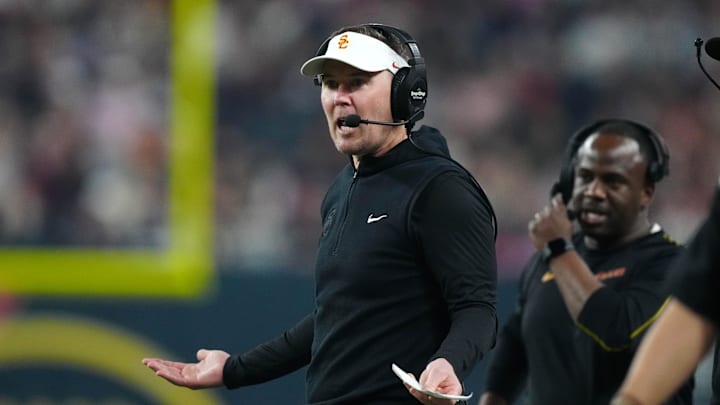 Dec 27, 2024; Las Vegas, NV, USA; Southern California Trojans head coach Lincoln Riley reacts against the Texas A&M Aggies in the first half at Allegiant Stadium. Mandatory Credit: Kirby Lee-Imagn Images