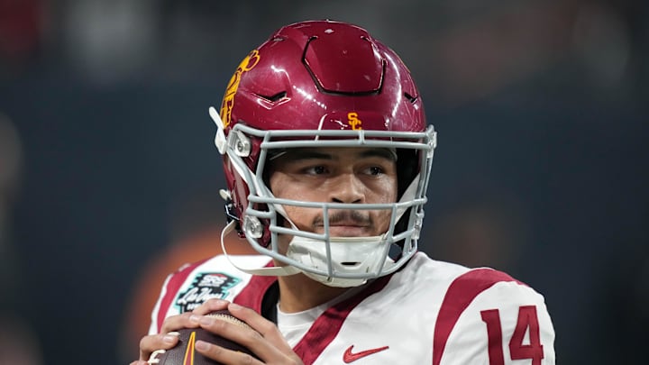 Dec 27, 2024; Las Vegas, NV, USA; Southern California Trojans quarterback Jayden Maiava (14) throws the ball against the Texas A&M Aggies in the first half at Allegiant Stadium. Mandatory Credit: Kirby Lee-Imagn Images Dec 27, 2024; Las Vegas, NV, USA; Southern California Trojans quarterback Jayden Maiava (14) throws the ball against the Texas A&M Aggies in the first half at Allegiant Stadium. Mandatory Credit: Kirby Lee-Imagn Images