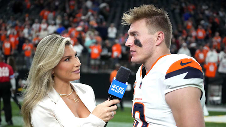 Nov 24, 2024; Paradise, Nevada, USA; CBS Sports reporter Melanie Collins (left) interviews Denver Broncos quarterback Bo Nix (10) after the game against the Las Vegas Raiders at Allegiant Stadium. Mandatory Credit: Kirby Lee-Imagn Images