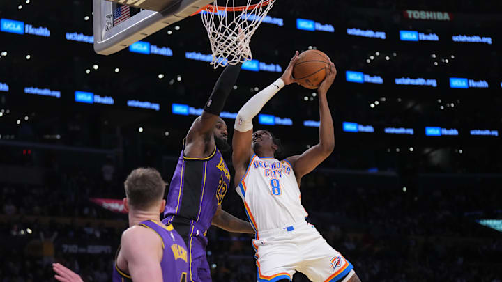 Nov 29, 2024; Los Angeles, California, USA; Oklahoma City Thunder forward Jalen Williams (8) shoots the ball against Los Angeles Lakers forward LeBron James (23) in the second half at Crypto.com Arena. Mandatory Credit: Kirby Lee-Imagn Images