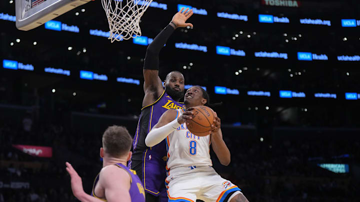 Nov 29, 2024; Los Angeles, California, USA; Oklahoma City Thunder forward Jalen Williams (8) shoots the ball against Los Angeles Lakers forward LeBron James (23) in the second half at Crypto.com Arena. Mandatory Credit: Kirby Lee-Imagn Images