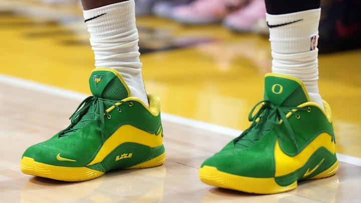 Dec 15, 2024; Los Angeles, California, USA; A detailed view of the green and yellow Nike LeBron XXII shoes with Oregon Ducks logo worn by Los Angeles Lakers forward LeBron James (23) against the Memphis Grizzlies at Crypto.com Arena. 