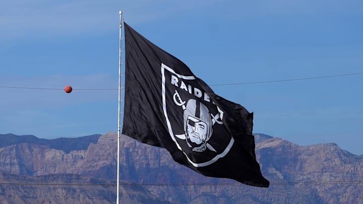 Nov 24, 2024; Paradise, Nevada, USA; A Las Vegas Raiders flag near Allegiant Stadium. Mandatory Credit: Kirby Lee-Imagn Images