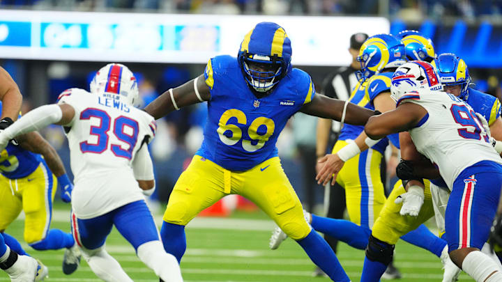 Dec 8, 2024; Inglewood, California, USA; Los Angeles Rams guard Kevin Dotson (69) wears a Guardian helmet cap against the Buffalo Bills in the second half at SoFi Stadium. Mandatory Credit: Kirby Lee-Imagn Images