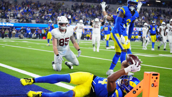 Dec 28, 2024; Inglewood, California, USA; Los Angeles Rams cornerback Ahkello Witherspoon (4) intercepts a pass with 42 seconds left against the Arizona Cardinals at SoFi Stadium. Mandatory Credit: Kirby Lee-Imagn Images