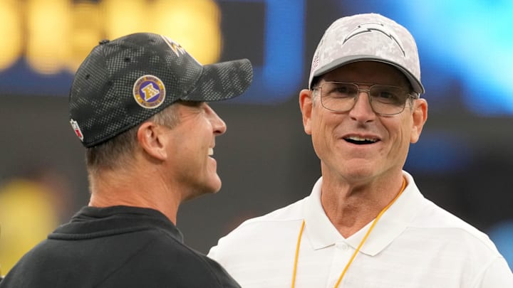 Baltimore Ravens coach John Harbaugh with brother and Los Angeles Chargers coach Jim Harbaugh before the game at SoFi Stadium. Baltimore Ravens coach John Harbaugh with brother and Los Angeles Chargers coach Jim Harbaugh before the game at SoFi Stadium.
