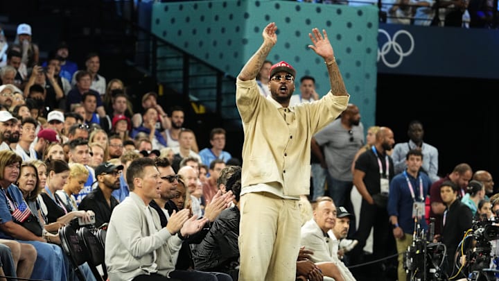Aug 10, 2024; Paris, France; Carmelo Anthony cheers in the second half against France in the men's basketball gold medal game during the Paris 2024 Olympic Summer Games at Accor Arena. Mandatory Credit: Rob Schumacher-Imagn Images