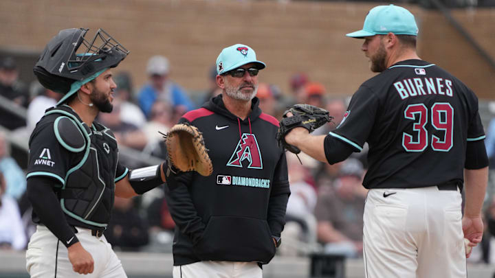 Mar 3, 2025; Salt River Pima-Maricopa, Arizona, USA; Arizona Diamondbacks manager Torey Lovullo (17) takes out pitcher Corbin Burnes (39) in the third inning against the Chicago Cubs at Salt River Fields at Talking Stick. Mandatory Credit: Rick Scuteri-Imagn Images Mar 3, 2025; Salt River Pima-Maricopa, Arizona, USA; Arizona Diamondbacks manager Torey Lovullo (17) takes out pitcher Corbin Burnes (39) in the third inning against the Chicago Cubs at Salt River Fields at Talking Stick. Mandatory Credit: Rick Scuteri-Imagn Images