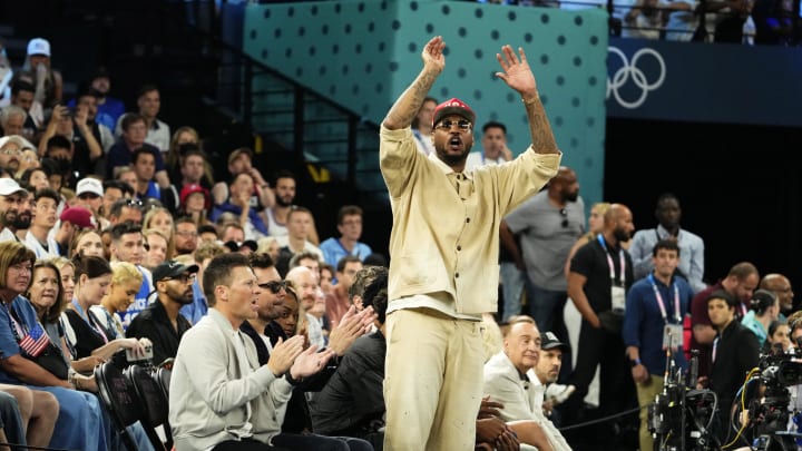 Aug 10, 2024; Paris, France; Carmelo Anthony cheers in the second half against France in the men's basketball gold medal game during the Paris 2024 Olympic Summer Games at Accor Arena. Aug 10, 2024; Paris, France; Carmelo Anthony cheers in the second half against France in the men's basketball gold medal game during the Paris 2024 Olympic Summer Games at Accor Arena.