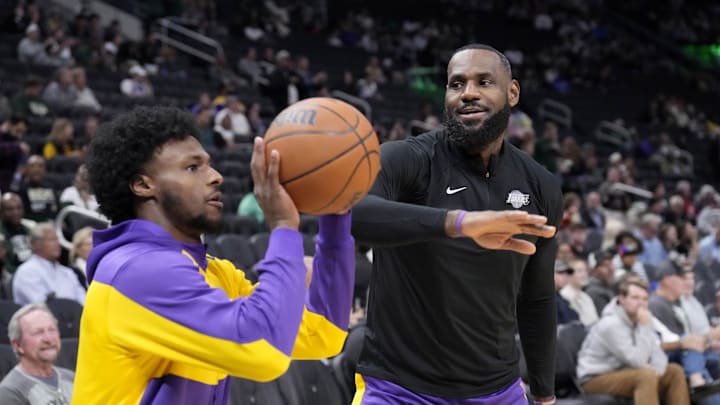 Oct 10, 2024; Milwaukee, Wisconsin, USA; Los Angeles Lakers forward LeBron James (23) goofs around with his son guard Bronny James (9) during warm ups before their game against the Milwaukee Bucks at Fiserv Forum. Mandatory Credit: Michael McLoone-Imagn Images Oct 10, 2024; Milwaukee, Wisconsin, USA; Los Angeles Lakers forward LeBron James (23) goofs around with his son guard Bronny James (9) during warm ups before their game against the Milwaukee Bucks at Fiserv Forum. Mandatory Credit: Michael McLoone-Imagn Images