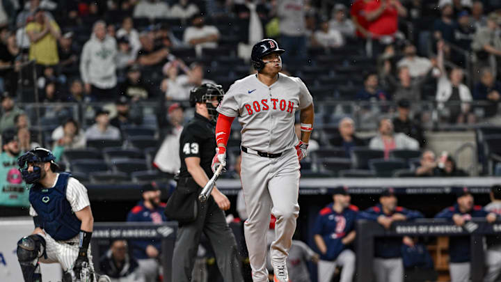 Boston Red Sox designated hitter Rafael Devers (11) reacts after hitting a solo home run against the New York Yankees during the ninth inning at Yankee Stadium on June 8. Boston Red Sox designated hitter Rafael Devers (11) reacts after hitting a solo home run against the New York Yankees during the ninth inning at Yankee Stadium on June 8.