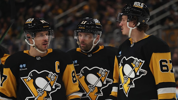 Mar 13, 2025; Pittsburgh, Pennsylvania, USA; Pittsburgh Penguins center Sidney Crosby (87) talks with right wing Bryan Rust (17) and right wing Rickard Rakell (67) against the St. Louis Blues during the third period at PPG Paints Arena. Mandatory Credit: Charles LeClaire-Imagn Images