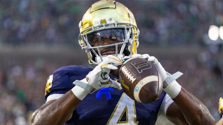 Sep 20, 2025; South Bend, Indiana, USA; Notre Dame Fighting Irish running back Jeremiyah Love (4) celebrates scoring against the Purdue Boilermakers in the second half at Notre Dame Stadium. Mandatory Credit: Michael Caterina-Imagn Images