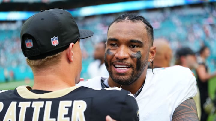 Miami Gardens, Florida, USA; Miami Dolphins quarterback Tua Tagovailoa (1) with New Orleans Saints quarterback Spencer Rattler (2) following a game at Hard Rock Stadium. Miami Gardens, Florida, USA; Miami Dolphins quarterback Tua Tagovailoa (1) with New Orleans Saints quarterback Spencer Rattler (2) following a game at Hard Rock Stadium.
