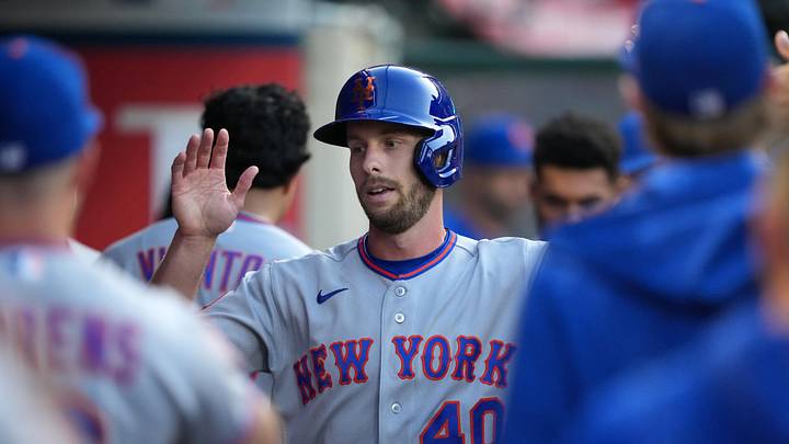 May 2, 2026; Anaheim, California, USA; New York Mets right fielder Austin Slater (40) is congratulated by teammates after scoring in the third inning against the Los Angeles Angels at Angel Stadium. Mandatory Credit: Kirby Lee-Imagn Images