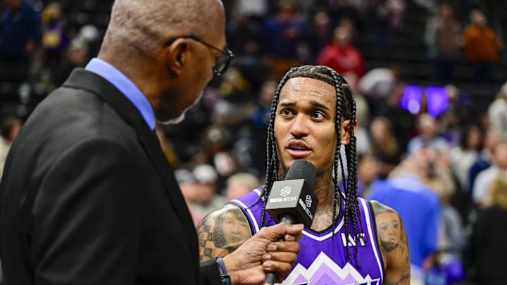Mar 4, 2024; Salt Lake City, Utah, USA; Utah Jazz guard Jordan Clarkson (00) is interviewed by Thurl Bailey following a victory over the Washington Wizards at the Delta Center. Mandatory Credit: Christopher Creveling-Imagn Images