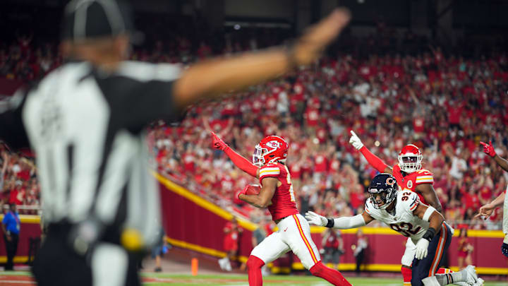 Aug 22, 2024; Kansas City, Missouri, USA; Kansas City Chiefs safety Jaden Hicks (21) recovers a fumble against Chicago Bears defensive end Daniel Hardy (92) during the first half at GEHA Field at Arrowhead Stadium. Mandatory Credit: Jay Biggerstaff-Imagn Images