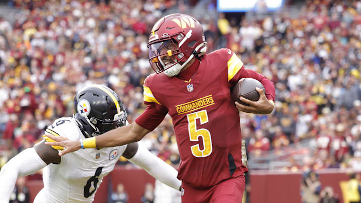 Nov 10, 2024; Landover, Maryland, USA; Washington Commanders quarterback Jayden Daniels (5) carries the ball as Pittsburgh Steelers linebacker Patrick Queen (6) defends during the first half at Northwest Stadium. Nov 10, 2024; Landover, Maryland, USA; Washington Commanders quarterback Jayden Daniels (5) carries the ball as Pittsburgh Steelers linebacker Patrick Queen (6) defends during the first half at Northwest Stadium.