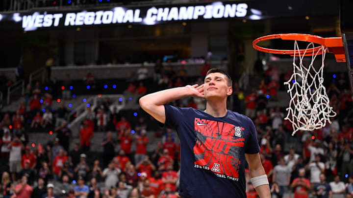 Mar 28, 2026; San Jose, CA, USA; Arizona Wildcats forward Ivan Kharchenkov (8) prepares to cut down the net after an Elite Eight game against the Purdue Boilermakers of the West Regional of the men's 2026 NCAA Tournament at SAP Center. Mandatory Credit: Eakin Howard-Imagn Images Mar 28, 2026; San Jose, CA, USA; Arizona Wildcats forward Ivan Kharchenkov (8) prepares to cut down the net after an Elite Eight game against the Purdue Boilermakers of the West Regional of the men's 2026 NCAA Tournament at SAP Center. Mandatory Credit: Eakin Howard-Imagn Images
