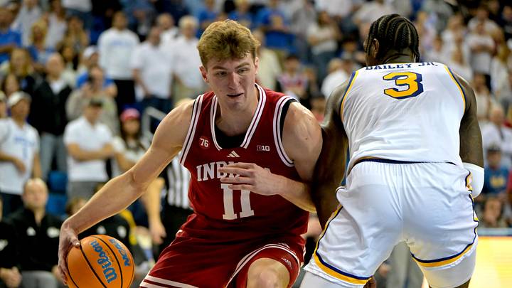 Jan 31, 2026; Los Angeles, California, USA; Indiana Hoosiers forward Trent Sisley (11) is fouled by UCLA Bruins guard Eric Dailey Jr. (3) as he drives to the basket in the second half at Pauley Pavilion presented by Wescom Financial. Mandatory Credit: Jayne Kamin-Oncea-Imagn Images