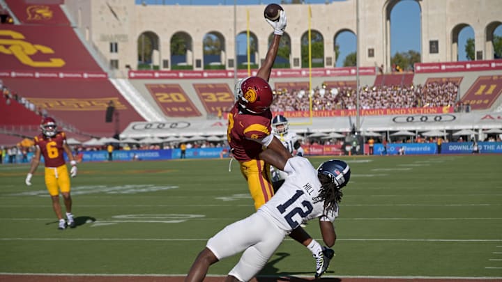 Sep 6, 2025; Los Angeles, California, USA;  USC Trojans wide receiver Ja'Kobi Lane (8) makes a one handed catch for a touchdown as he is defended by Georgia Southern Eagles defensive back Tracy Hill Jr. (12) during the first quarter at United Airlines Field at Los Angeles Memorial Coliseum. 