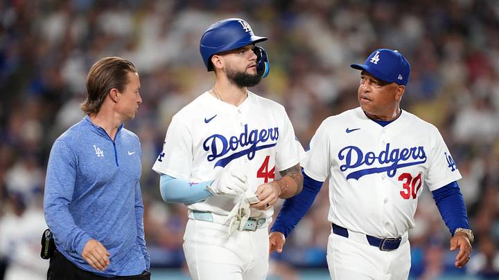 Aug 21, 2026; Los Angeles, California, USA; Los Angeles Dodgers center fielder Andy Pages (44) walks with head athletic trainer Thomas Albert (left) and manager Dave Roberts (30) after being hit by a pitch in the third inning against the Pittsburgh Pirates at Dodger Stadium. Mandatory Credit: Kirby Lee-Imagn Images