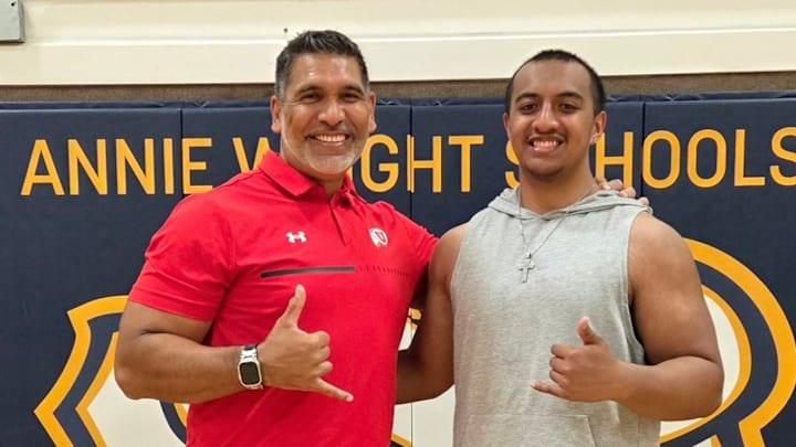 Ta'a Malu, right, has committed to the UW. Ta'a Malu, right, has committed to the UW.