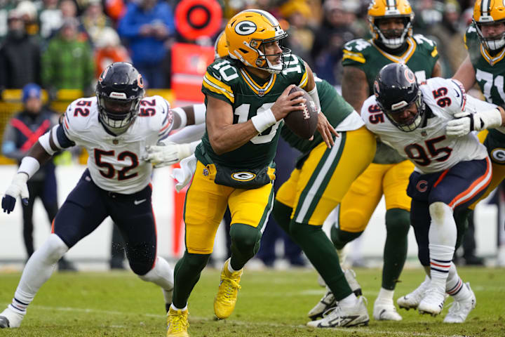 Green Bay Packers quarterback Jordan Love buys time againstt the Bears last season.