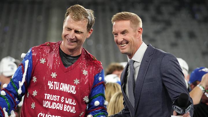 Jan 2, 2026; San Diego, CA, USA; SMU Mustangs head coach Rhett Lashlee (left) poses with Fox Sports broadcaster Joel Klatt after victory over the Arizona Wildcats in the Holiday Bowl at Snapdragon Stadium. Mandatory Credit: Kirby Lee-Imagn Images Jan 2, 2026; San Diego, CA, USA; SMU Mustangs head coach Rhett Lashlee (left) poses with Fox Sports broadcaster Joel Klatt after victory over the Arizona Wildcats in the Holiday Bowl at Snapdragon Stadium. Mandatory Credit: Kirby Lee-Imagn Images