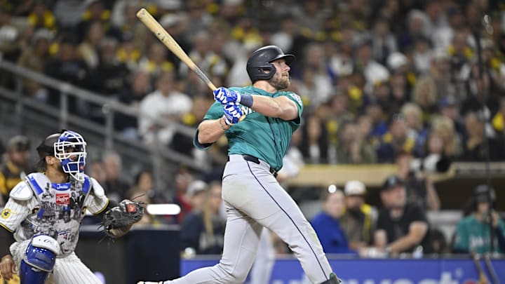 Apr 15, 2026; San Diego, California, USA; Seattle Mariners right fielder Luke Raley  hits a two-run home run during the fifth inning against the San Diego Padres at Petco Park. All MLB players are wearing number 42 today to honor Jackie Robinson. Mandatory Credit: Denis Poroy-Imagn Images
