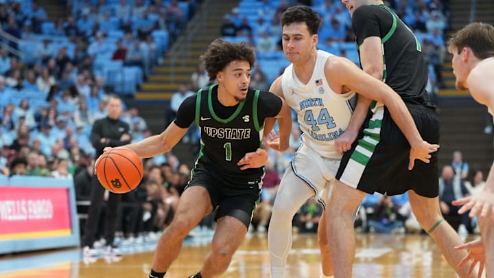 Dec 13, 2025; Chapel Hill, North Carolina, USA; USC Upstate Spartans guard Karmani Gregory (1) with the ball as North Carolina Tar Heels guard Luka Bogavac (44) defends at Dean E. Smith Center. Mandatory Credit: Bob Donnan-Imagn Images Dec 13, 2025; Chapel Hill, North Carolina, USA; USC Upstate Spartans guard Karmani Gregory (1) with the ball as North Carolina Tar Heels guard Luka Bogavac (44) defends at Dean E. Smith Center. Mandatory Credit: Bob Donnan-Imagn Images