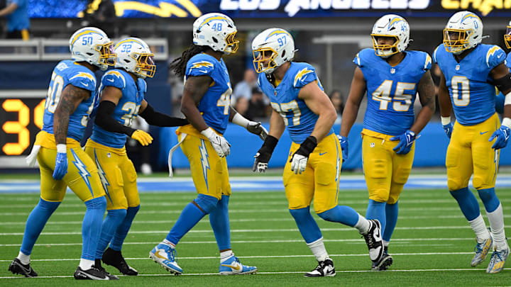 Nov 10, 2024; Inglewood, California, USA; Los Angeles Chargers linebacker Caleb Murphy (50),  Los Angeles safety Alohi Gilman (32), linebacker Bud Dupree (48), linebacker Joey Bosa (97), linebacker Tuli Tuipulotu (45), and  linebacker Daiyan Henley (0) during the fourth quarter against the Tennessee Titans at SoFi Stadium. Mandatory Credit: Robert Hanashiro-Imagn Images