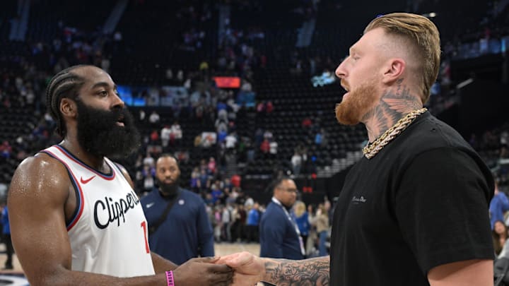 Nov 9, 2024; Inglewood, California, USA; Los Angeles Clippers guard James Harden (1) talks with Las Vegas Raiders tight end Maxx Crosby (98) following the game against the Toronto Raptors at Intuit Dome. Mandatory Credit: Jayne Kamin-Oncea-Imagn Images