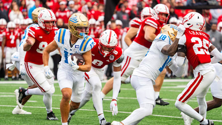 Nov 2, 2024; Lincoln, Nebraska, USA; UCLA Bruins wide receiver Logan Loya (17) returns a punt against Nebraska Cornhuskers defensive back DeShon Singleton (8) and defensive back Jeremiah Charles (25) during the second quarter at Memorial Stadium. Nov 2, 2024; Lincoln, Nebraska, USA; UCLA Bruins wide receiver Logan Loya (17) returns a punt against Nebraska Cornhuskers defensive back DeShon Singleton (8) and defensive back Jeremiah Charles (25) during the second quarter at Memorial Stadium.