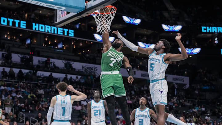 Oct 19, 2023; Charlotte, North Carolina, USA; Boston Celtics guard Jaylen Brown (7) gets a dunk vs. the Charlotte Hornets