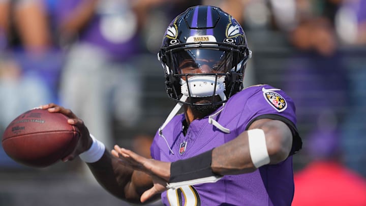 Oct 13, 2024; Baltimore, Maryland, USA; Baltimore Ravens quarterback Lamar Jackson (8) warms up prior to the game against the Washington Commanders at M&T Bank Stadium. Mandatory Credit: Mitch Stringer-Imagn Images