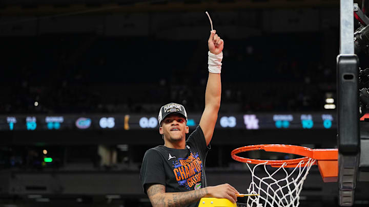 Apr 7, 2025; San Antonio, TX, USA; Florida Gators guard Will Richard (5) reacts after cutting down a piece of the net after winning the national championship game of the Final Four of the 2025 NCAA Tournament at the Alamodome. Mandatory Credit: Bob Donnan-Imagn Images