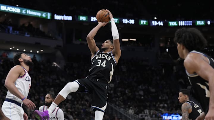 Feb 20, 2025; Milwaukee, Wisconsin, USA; Milwaukee Bucks forward Giannis Antetokounmpo (34) puts up a shot against LA Clippers guard Ben Simmons (25) in the second  half at Fiserv Forum. Mandatory Credit: Michael McLoone-Imagn Images