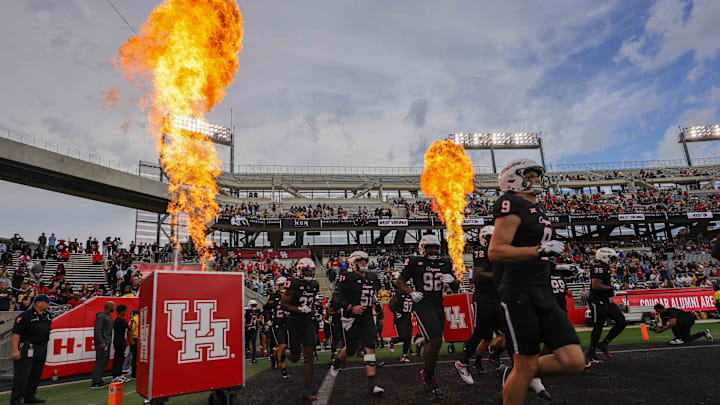 Nov 1, 2025; Houston, Texas, USA; The Houston Cougars run out onto the field before playing against the West Virginia Mountaineers at TDECU Stadium. Mandatory Credit: Thomas Shea-Imagn Images