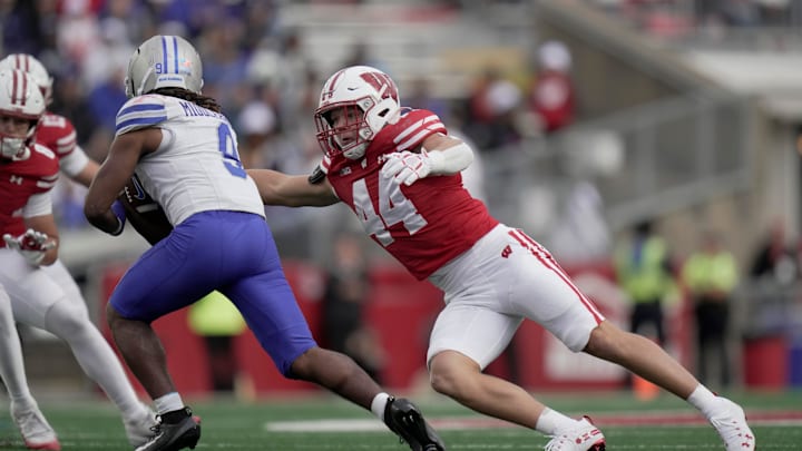 Wisconsin linebacker Cooper Catalano (44) tackles Middle Tennessee running back Jekail Middlebrook (9) during the fourth quarter of the game Saturday, September 6, 2025 at Camp Randall Stadium in Madison, Wisconsin. Wisconsin beat Middle Tennessee 42-10.