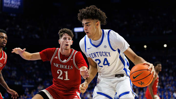 Nov 4, 2025; Lexington, Kentucky, USA; Kentucky Wildcats center Malachi Moreno (24) drives to the basket around Nicholls Colonels guard Nick Krass (21) during the second half at Rupp Arena at Central Bank Center. Mandatory Credit: Jordan Prather-Imagn Images