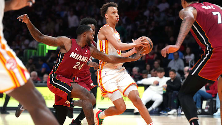Feb 26, 2025; Miami, Florida, USA;  Miami Heat forward Haywood Highsmith (24) tips the ball away from Atlanta Hawks guard Dyson Daniels (5) in the second half at Kaseya Center. Mandatory Credit: Jim Rassol-Imagn Images