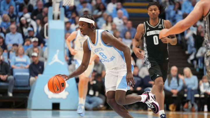 Dec 7, 2025; Chapel Hill, North Carolina, USA; North Carolina Tar Heels forward Caleb Wilson (8) with the ball as Georgetown Hoyas forward Jayden Fort (0) defends in the second half at Dean E. Smith Center. Mandatory Credit: Bob Donnan-Imagn Images Dec 7, 2025; Chapel Hill, North Carolina, USA; North Carolina Tar Heels forward Caleb Wilson (8) with the ball as Georgetown Hoyas forward Jayden Fort (0) defends in the second half at Dean E. Smith Center. Mandatory Credit: Bob Donnan-Imagn Images