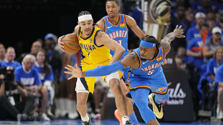 Oklahoma City Thunder guard Luguentz Dort (5) reaches for the ball against Indiana Pacers guard Andrew Nembhard (2) during the second half during game two of the 2025 NBA Finals at Paycom Center. Oklahoma City Thunder guard Luguentz Dort (5) reaches for the ball against Indiana Pacers guard Andrew Nembhard (2) during the second half during game two of the 2025 NBA Finals at Paycom Center.