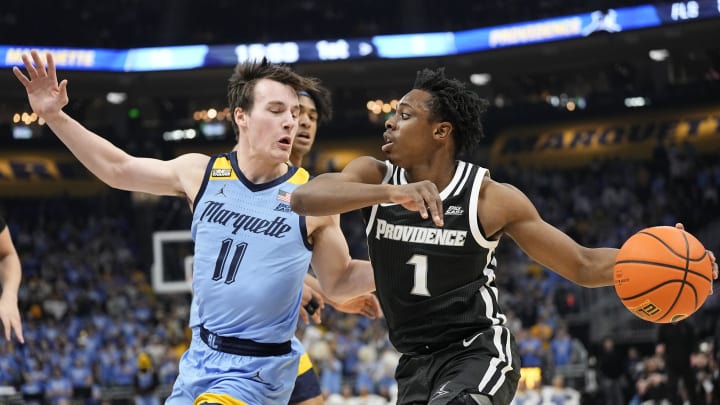 Feb 28, 2024; Milwaukee, Wisconsin, USA;  Providence Friars guard Jayden Pierre (1) drives for the basket against Marquette Golden Eagles guard Tyler Kolek (11) during the first half at Fiserv Forum. Mandatory Credit: Jeff Hanisch-USA TODAY Sports